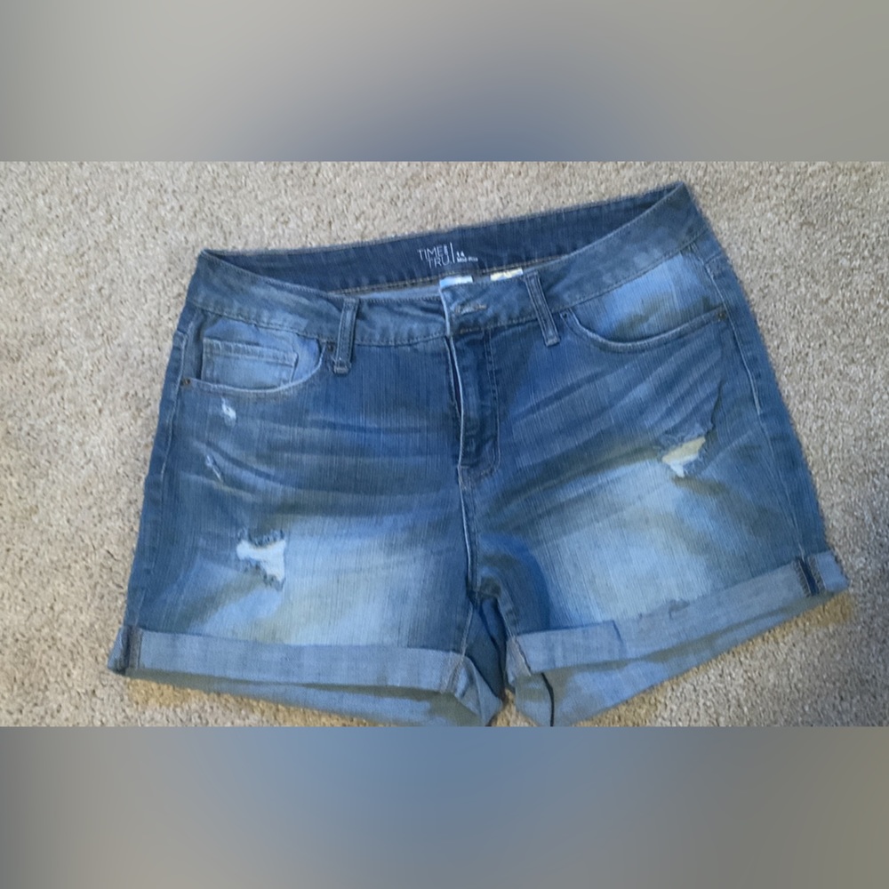 Women’s torn jean shorts size 14.